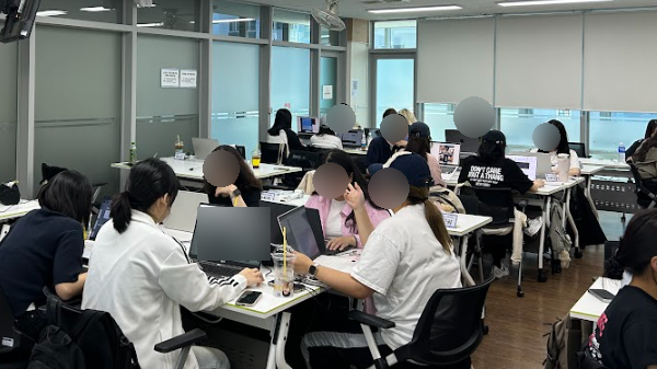 Learners working on assignments together in the Ministry of Employment and Labor's KDT program