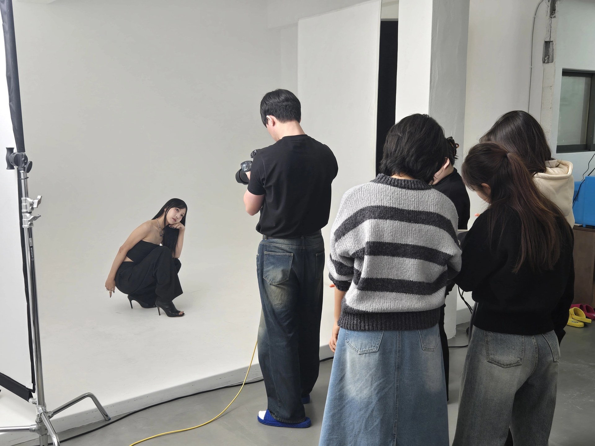 Practical project participants working together on a photo shoot