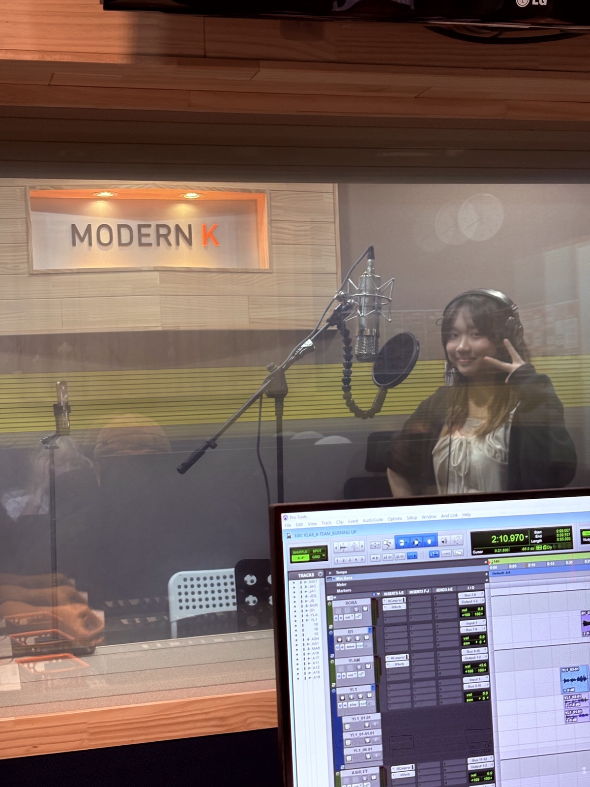 A GCP participant at the microphone in a recording booth