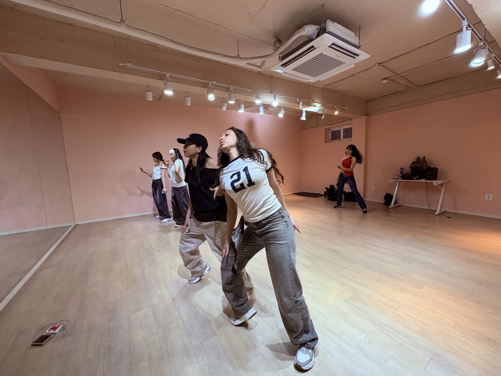 Participants rehearsing choreography in a practice room