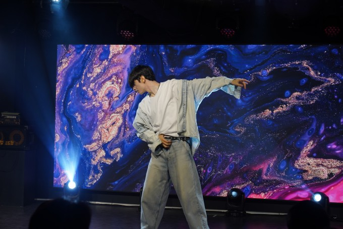 A participant giving a solo performance on stage
