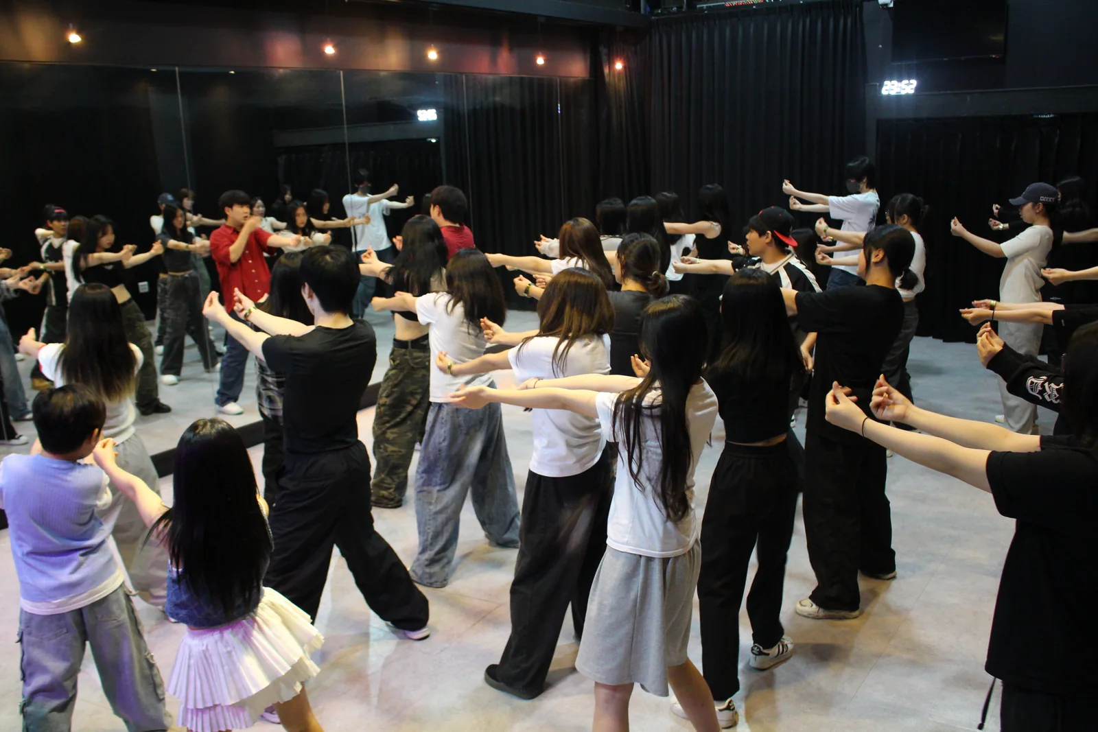 Participants practicing choreography together in a Modern K dance class